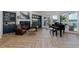 Cozy living room features a fireplace, built-in bar, and views of the backyard and waterway at 1834 Daiquiri Ln, Lutz, FL 33549
