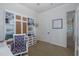 Home office with custom cabinets featuring a built-in desk and stylish decor for the discerning professional at 1834 Daiquiri Ln, Lutz, FL 33549
