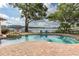Backyard pool and spa with lake view, perfect for relaxation and entertainment at 1834 Daiquiri Ln, Lutz, FL 33549