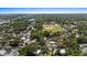 Aerial view showing the community area with a baseball field in the distance and residential neighborhoods at 212 W Powhatan Ave, Tampa, FL 33604