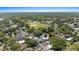 Aerial view showing the community area with a baseball field in the distance and residential neighborhoods at 212 W Powhatan Ave, Tampa, FL 33604