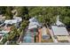 Aerial view of a charming single Gathering home with a screened pool, fenced yard and detached garage at 212 W Powhatan Ave, Tampa, FL 33604