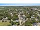 Aerial view highlighting property location within a tree-filled neighborhood close to downtown Tampa at 212 W Powhatan Ave, Tampa, FL 33604
