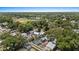 Aerial view shows lush trees surrounding the home and neighborhood at 212 W Powhatan Ave, Tampa, FL 33604
