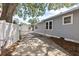 Long driveway leading to detached garage and charming home exterior at 212 W Powhatan Ave, Tampa, FL 33604