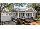 Charming craftsman home featuring a quaint front porch with swing and brick accents at 212 W Powhatan Ave, Tampa, FL 33604