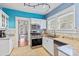 Bright kitchen showcasing white cabinets, granite countertops, and modern appliances at 212 W Powhatan Ave, Tampa, FL 33604