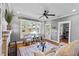 Inviting living room with fireplace, hardwood floors, and lots of natural light at 212 W Powhatan Ave, Tampa, FL 33604