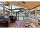 Inviting screened-in pool area perfect for relaxation with comfortable lounge chairs and a private setting at 212 W Powhatan Ave, Tampa, FL 33604