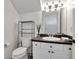 Bright bathroom featuring a white vanity with dark countertop and modern fixtures at 2173 Tuscany Trce # 8, Palm Harbor, FL 34683