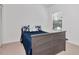 Cozy bedroom with a comfortable bed, closet, and a window allowing natural light at 2173 Tuscany Trce # 8, Palm Harbor, FL 34683