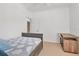 Clean bedroom featuring a ceiling fan, ensuite bathroom, and desk on carpeted floors at 2173 Tuscany Trce # 8, Palm Harbor, FL 34683