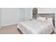 Bright bedroom with natural light, a comfortable bed, and neutral decor at 2173 Tuscany Trce # 8, Palm Harbor, FL 34683