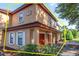 Townhome with a red door and a unit number 16-2173, featuring a well-maintained front exterior at 2173 Tuscany Trce # 8, Palm Harbor, FL 34683