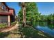Lakeside condo complex with manicured lawn and screened patios at 2173 Tuscany Trce # 8, Palm Harbor, FL 34683