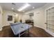 A game room with a ping pong table, a small seating area, and hardwood floors at 2173 Tuscany Trce # 8, Palm Harbor, FL 34683