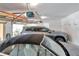 Open garage featuring two cars with an automatic door opener at 2173 Tuscany Trce # 8, Palm Harbor, FL 34683
