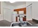 Galley kitchen featuring wood cabinets, white appliances, and ample counter space at 2173 Tuscany Trce # 8, Palm Harbor, FL 34683