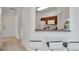 Well-lit kitchen with breakfast bar seating and easy access to the entryway at 2173 Tuscany Trce # 8, Palm Harbor, FL 34683