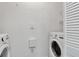 Well-lit laundry room with modern washer and dryer units and ample space at 2173 Tuscany Trce # 8, Palm Harbor, FL 34683