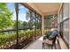 Relaxing screened patio with scenic lake views and comfortable seating at 2173 Tuscany Trce # 8, Palm Harbor, FL 34683