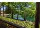 Beautiful green pond view showing the landscaping and fountain feature at 2173 Tuscany Trce # 8, Palm Harbor, FL 34683