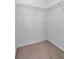 Empty walk-in closet with carpeted floors and wire shelving at 2173 Tuscany Trce # 8, Palm Harbor, FL 34683