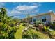 Lush backyard featuring well-maintained lawn, vibrant plants, and comfortable seating, creating a serene outdoor oasis at 2247 Midnight Pearl Dr, Sarasota, FL 34240