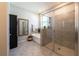 Primary bathroom featuring a soaking tub, enclosed glass shower, and neutral color palette at 2247 Midnight Pearl Dr, Sarasota, FL 34240