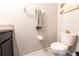 Toilet next to countertop with towels hung above at 2247 Midnight Pearl Dr, Sarasota, FL 34240