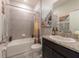 Well-lit bathroom featuring a bath and shower combo and granite countertops at 2247 Midnight Pearl Dr, Sarasota, FL 34240
