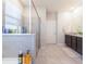 This primary bathroom features an enclosed glass shower, soaking tub and double vanity at 2247 Midnight Pearl Dr, Sarasota, FL 34240