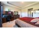This bedroom also features a desk area, dresser and neutral walls at 2247 Midnight Pearl Dr, Sarasota, FL 34240