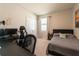 Bedroom featuring a large computer desk, chair, closet, and a bed with night stand at 2247 Midnight Pearl Dr, Sarasota, FL 34240