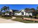 Charming single-story home with stone accents, well-maintained landscaping, and a welcoming walkway, offering curb appeal at 2247 Midnight Pearl Dr, Sarasota, FL 34240