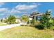 Attractive home featuring stone accents, well-manicured landscaping, and a spacious driveway at 2247 Midnight Pearl Dr, Sarasota, FL 34240