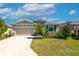 Charming one-story home featuring stone accents and a well-maintained lawn in a desirable neighborhood at 2247 Midnight Pearl Dr, Sarasota, FL 34240