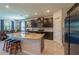 View of the kitchen with granite countertops, stainless steel appliances, and dark wood cabinets at 2247 Midnight Pearl Dr, Sarasota, FL 34240