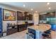 Spacious kitchen featuring a granite island, stainless steel appliances, and dark wood cabinetry at 2247 Midnight Pearl Dr, Sarasota, FL 34240