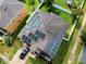 Aerial view of a home with solar panels installed on the roof, showcasing a green energy solution and modern design at 2325 Via Bella Blvd, Land O Lakes, FL 34639