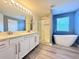 Spa-like bathroom with double vanity, walk-in shower, and freestanding tub at 2325 Via Bella Blvd, Land O Lakes, FL 34639