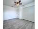 Well-lit bedroom boasts a ceiling fan, window, and a closet at 2325 Via Bella Blvd, Land O Lakes, FL 34639