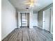 A bedroom featuring light gray vinyl flooring, a closet, and white walls at 2325 Via Bella Blvd, Land O Lakes, FL 34639
