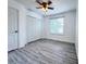 Bright bedroom featuring a ceiling fan, window, and a large closet at 2325 Via Bella Blvd, Land O Lakes, FL 34639