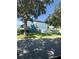 Exterior view of a home with a blue facade and a well-maintained lawn at 2325 Via Bella Blvd, Land O Lakes, FL 34639