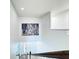 Bright foyer features a city themed art piece, with white walls and vinyl plank flooring at 2325 Via Bella Blvd, Land O Lakes, FL 34639