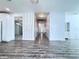 Hallway with view of front door, decorative wall, and access to multiple rooms at 2325 Via Bella Blvd, Land O Lakes, FL 34639
