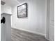 Hallway showcases updated flooring and neutral paint, ready for personal touches at 2325 Via Bella Blvd, Land O Lakes, FL 34639