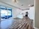 Bright kitchen with white cabinetry, stainless steel appliances, and sliding glass doors to patio at 2325 Via Bella Blvd, Land O Lakes, FL 34639