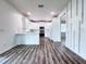 Kitchen with quartz countertops and white cabinets and stainless appliances at 2325 Via Bella Blvd, Land O Lakes, FL 34639